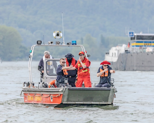 a-group-of-people-on-a-boat-in-the-water